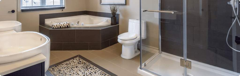 Remodeled bathroom with a corner soaking tub, double vanity, and glass shower | Blue Rock Roofing & Construction | Best bathroom remodeling in Fort Mill, SC