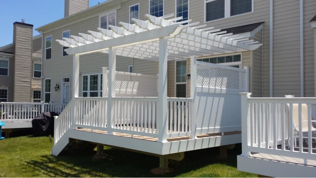 White backyard deck with pergola and privacy panels